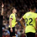 BIRMINGHAM, ENGLAND - DECEMBER 30: Sander Berge of Burnley is shown a red card by Referee Stuart Attwell during the Premier League match between Aston Villa and Burnley FC at Villa Park on December 30, 2023 in Birmingham, England. (Photo by Richard Heathcote/Getty Images)