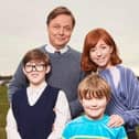 Taylor Fay (front right) who stars as Gary Carr in the new sitcom based on the life of comedian Alan Carr. Oliver Savell (left) plays Alan as a child and Nancy Sullivan Shaun Dooley plays the role of parents Graham and Christine Carr.