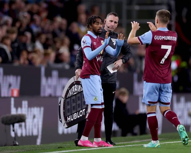 BURNLEY, ENGLAND - SEPTEMBER 23: Johann Guomundsson of Burnley interacts with Mike Tresor Ndayishimiye of Burnley after being substituted off during the Premier League match between Burnley FC and Manchester United at Turf Moor on September 23, 2023 in Burnley, England. (Photo by Lewis Storey/Getty Images)