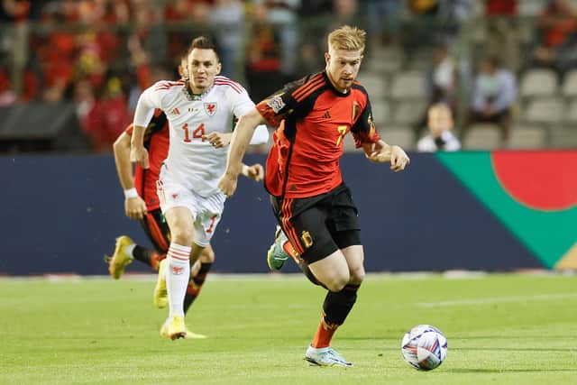 Welsh Connor Roberts and Belgium's Kevin De Bruyne fight for the ball during a soccer game between Belgian national team the Red Devils and Wales, Thursday 22 September 2022 in Brussels, game 5 (out of six) in the Nations League A group stage. BELGA PHOTO BRUNO FAHY (Photo by BRUNO FAHY / BELGA MAG / Belga via AFP) (Photo by BRUNO FAHY/BELGA MAG/AFP via Getty Images)