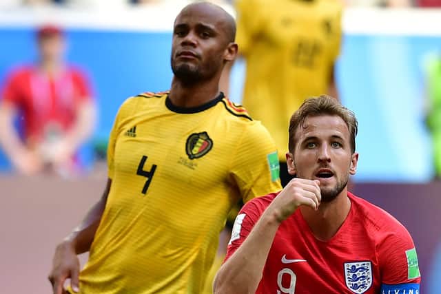 England's forward Harry Kane (R) looks on past Belgium's defender Vincent Kompany during their Russia 2018 World Cup play-off for third place football match between Belgium and England at the Saint Petersburg Stadium in Saint Petersburg on July 14, 2018.
