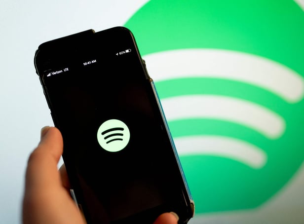 <p>This illustration photo shows the Spotify logo 
(Photo by Stefani Reynolds / AFP) (Photo by STEFANI REYNOLDS/AFP via Getty Images)</p>