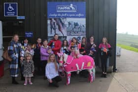 Tilly Norris, her American miniature horse Echo, dressed as Barbie, and young friends at HAPPA in Burnley
