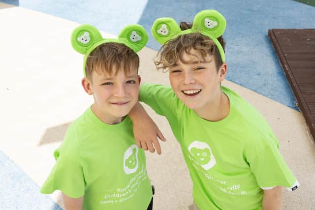 Hughie Higginson (left) and Freddie Xavi in their Royal Manchester Children's Hospital Charity T-shirts. A fundraising appeal to improve play facilities for poorly children from across the North West, fronted by  the best pals has hit the halfway point after just two months.