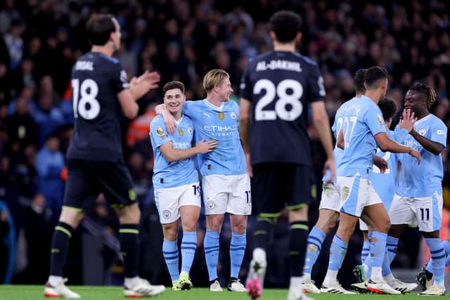 MANCHESTER, ENGLAND - JANUARY 31: Julian Alvarez of Manchester City celebrates scoring his team's second goal with Kevin De Bruyne during the Premier League match between Manchester City and Burnley FC at Etihad Stadium on January 31, 2024 in Manchester, England. (Photo by Alex Livesey/Getty Images)