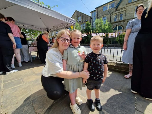 A family enjoy the bake sale event