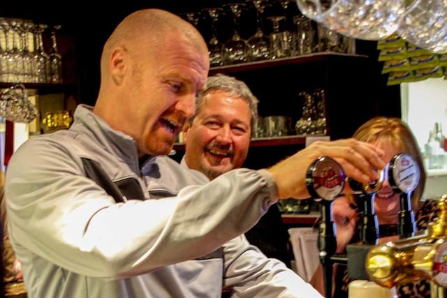 Sean Dyche pulls a pint at the official openng of The Queen Hotel, Cliviger in 2012
