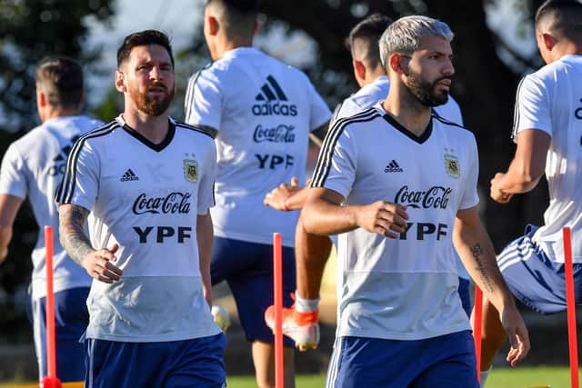 Argentina's Lionel Messi (L) and Argentina's Sergio Aguero train during a practice session in Belo Horizonte, Brazil, on July 1, 2019, on the eve of the Copa America tournament semi-final football match between Argentina and Brazil. (Photo by PEDRO UGARTE / AFP)        (Photo credit should read PEDRO UGARTE/AFP via Getty Images)