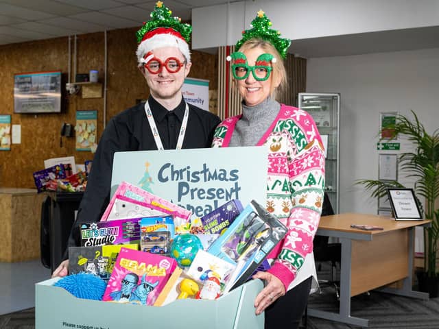The Christmas Present Appeal for 2023 has been launched at Down Town in Burnley Town Centre. Pictured  here are Nicola Larnach who is the co-ordinator for Burnley Together and Luke Molloy who is communications office for The Calico Group