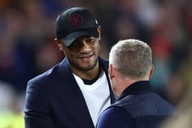 Burnley's Belgian manager Vincent Kompany (L) shakes hands with Nottingham Forest's Welsh manager Steve Cooper (R) ahead of kick-off in the English Premier League football match between Nottingham Forest and Burnley at The City Ground in Nottingham, central England, on September 18, 2023. (Photo by Darren Staples / AFP) / RESTRICTED TO EDITORIAL USE. No use with unauthorized audio, video, data, fixture lists, club/league logos or 'live' services. Online in-match use limited to 120 images. An additional 40 images may be used in extra time. No video emulation. Social media in-match use limited to 120 images. An additional 40 images may be used in extra time. No use in betting publications, games or single club/league/player publications. /  (Photo by DARREN STAPLES/AFP via Getty Images)