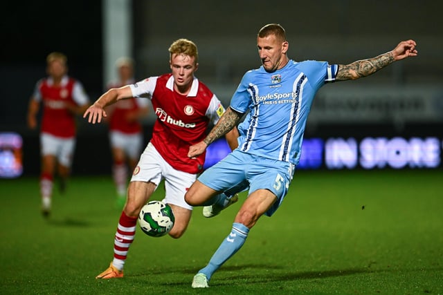 BURTON-UPON-TRENT, ENGLAND - AUGUST 10: Tommy Conway of Bristol City challenges Kyle McFadzean of Coventry City during the Carabao Cup First Round match between Coventry City and Bristol City at Pirelli Stadium on August 10, 2022 in Burton-upon-Trent, England. (Photo by Clive Mason/Getty Images)