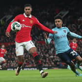 MANCHESTER, ENGLAND - DECEMBER 21: Marcus Rashford of Manchester United in action with Ian Maatsen of Burnley during the Carabao Cup Fourth Round match between Manchester United and Burnley at Old Trafford on December 21, 2022 in Manchester, England. (Photo by Matthew Peters/Manchester United via Getty Images)