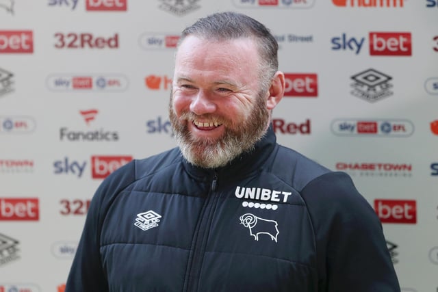 DERBY, ENGLAND - MAY 07: Wayne Rooney, former manager of Derby County, smiles in a media interview after the Sky Bet Championship match between Derby County and Cardiff City at Pride Park Stadium on May 07, 2022 in Derby, England. (Photo by Cameron Smith/Getty Images)