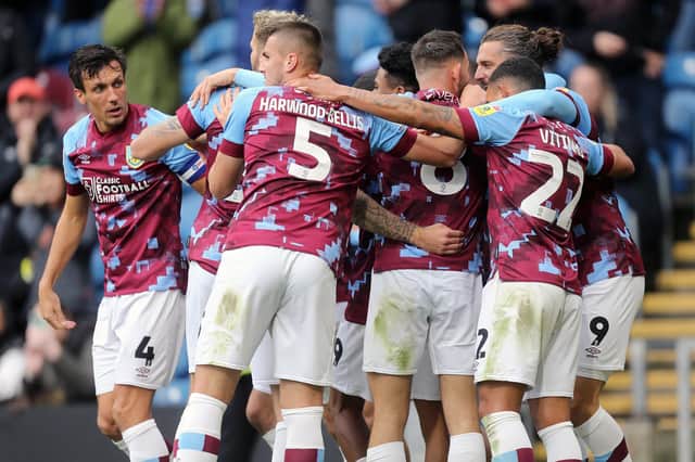 Burnley's Jay Rodriguez is mobbed by team-mates as he celebrates scoring his side's fourth goal 

The EFL Sky Bet Championship - Burnley v Swansea City - Saturday 15th October 2022 - Turf Moor - Burnley