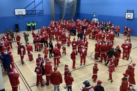 More than 230 folk dressed as Father Christmas gathered at West Craven Sports Centre in Barnoldswick