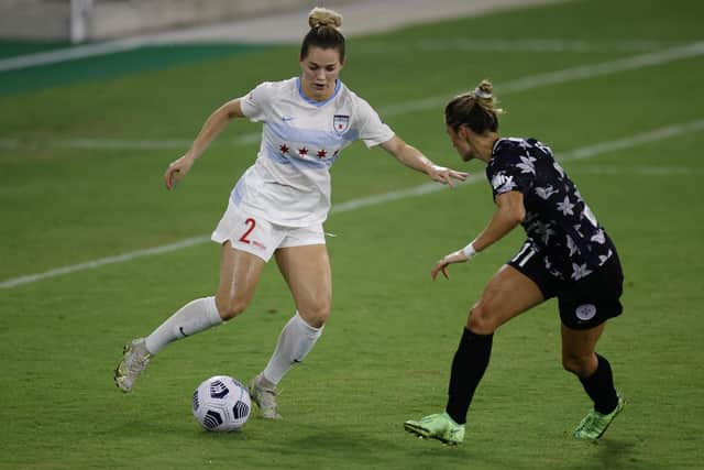 LOUISVILLE, KENTUCKY - AUGUST 18: Kealia Watt #2 of Chicago Red Stars dribbles by Emily Fox #11 of Racing Louisville FC at Lynn Family Stadium on August 18, 2021 in Louisville, Kentucky. (Photo by Tim Nwachukwu/Getty Images)