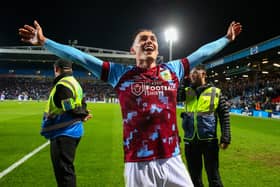 Roberts celebrates after helping Burnley win the title at Ewood Park