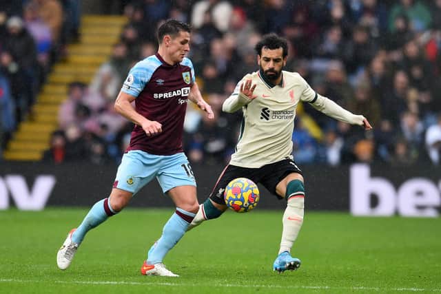 BURNLEY, ENGLAND - FEBRUARY 13: (THE SUN OUT, THE SUN ON SUNDAY OUT) Mohamed Salah of Liverpool competing with  Ashley Westwood of Burnley during the Premier League match between Burnley and Liverpool at Turf Moor on February 13, 2022 in Burnley, England. (Photo by Andrew Powell/Liverpool FC via Getty Images)