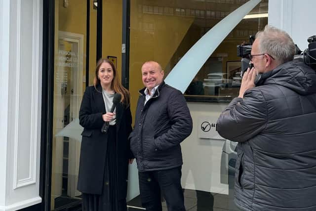 Burnley Place Brand Manager Rachel Bayley grabs a word with Dave Fishwick outside Bank of Dave during filming for his next film 'Bank of Dave: The Sequel'