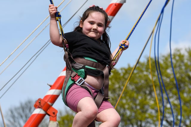 Emmie Hudson (5) enjoys the trampoline at Burnley fun fair at Towneley Park