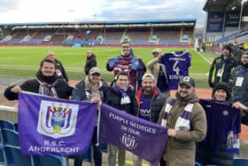 The RSC Anderlecht supporters display their club's famous purple and white colours at Turf Moor before Burnley's Championship match against Huddersfield Town