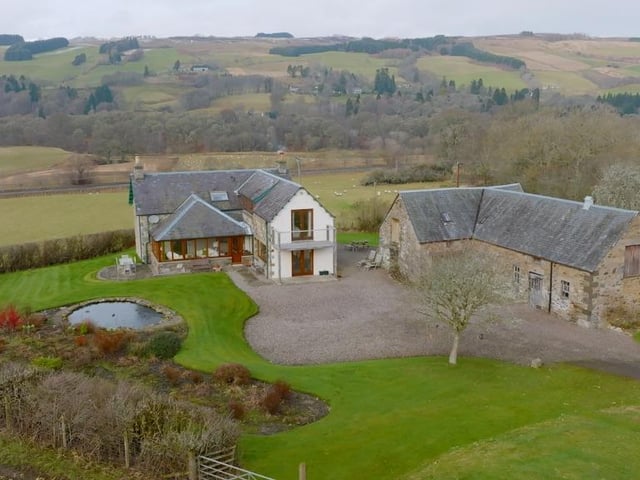 Aerial view of property from rear.
