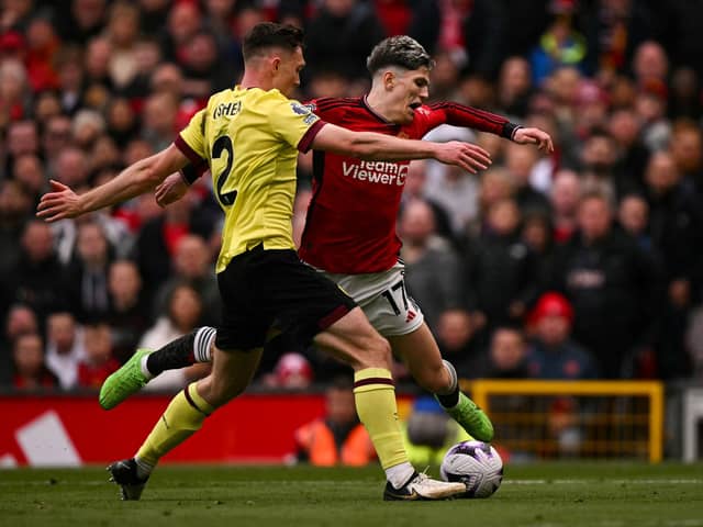 Burnley's Irish defender #02 Dara O'Shea (L) fights for the ball with Manchester United's Argentinian midfielder #17 Alejandro Garnacho during the English Premier League football match between Manchester United and Burnley at Old Trafford in Manchester, north west England, on April 27, 2024. (Photo by Oli SCARFF / AFP)