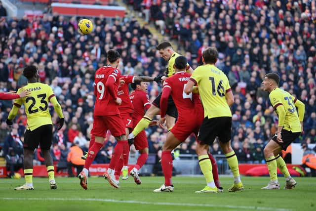 LIVERPOOL, ENGLAND - FEBRUARY 10: Dara O'Shea of Burnley scores his team's first goal during the Premier League match between Liverpool FC and Burnley FC at Anfield on February 10, 2024 in Liverpool, England. (Photo by Justin Setterfield/Getty Images)