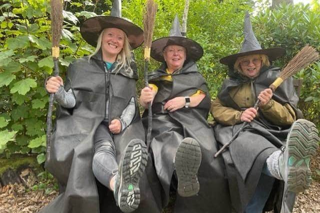 Pendleside staff Leah Hooper, Karen Charlton and Elaine Middleton put their best feet and brooms forward for the sponsored Witch Festival walk