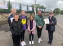 Some of the pupils who designed posters on sustainable travel which went on display at Rosegrove railway station in Burnley
