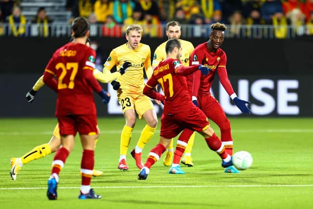 Roma's English forward Tammy Abraham  (R) gestures to Roma's Armenian midfielder Henrikh Mkhitaryan (C) during the UEFA Europa conference league football match FK Bodo/Glimt v AS Roma at Aspmyra Stadium in Bodo on April 7, 2022. - - Norway OUT (Photo by Mats Torbergsen / NTB / AFP) / Norway OUT (Photo by MATS TORBERGSEN/NTB/AFP via Getty Images)