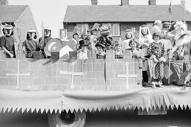 Can you spot any familiar faces dressed up on this float?