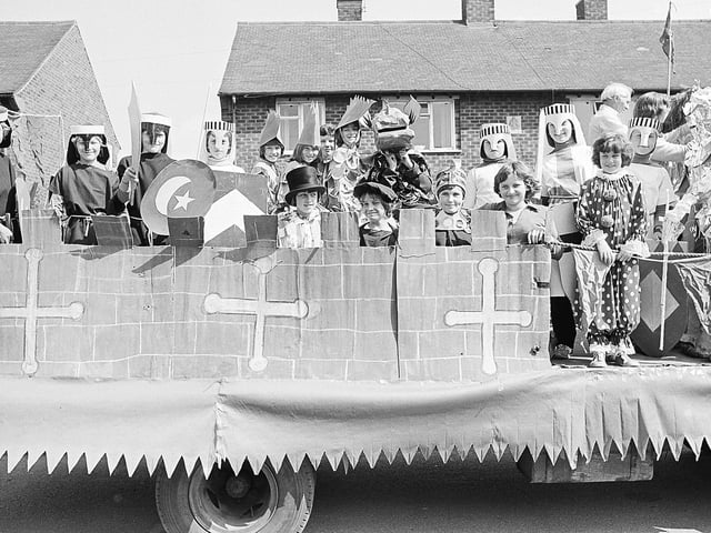 Can you spot any familiar faces dressed up on this float?
