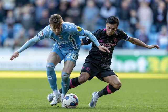 Burnley's Jack Cork competing with Coventry City's Josh Eccles (left) 

The EFL Sky Bet Championship  - Coventry City v Burnley- Saturday 8th October 2022 - Coventry Building Society Arena - Coventry