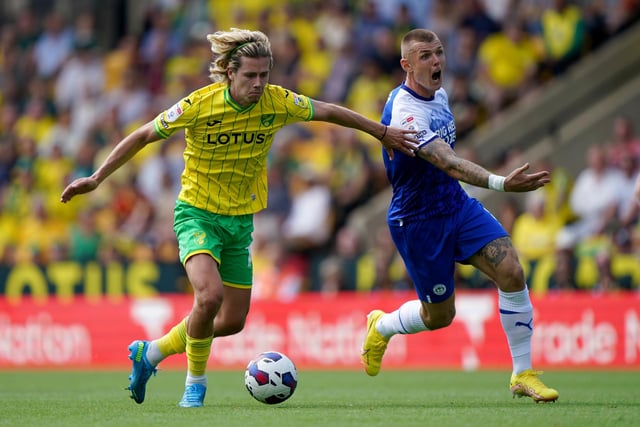 Norwich City's Todd Cantwell (left) and Wigan Athletic's Max Power battle for the ball during the Sky Bet Championship match at Carrow Road, Norwich. Picture date: Saturday August 6, 2022. PA Photo: Joe Giddens/PA Wire.