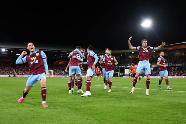 LUTON, ENGLAND - OCTOBER 03: Jacob Bruun Larsen of Burnley (obscured) celebrates with teammates after scoring the team's second goal during the Premier League match between Luton Town and Burnley FC at Kenilworth Road on October 03, 2023 in Luton, England. (Photo by Marc Atkins/Getty Images)