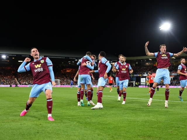 LUTON, ENGLAND - OCTOBER 03: Jacob Bruun Larsen of Burnley (obscured) celebrates with teammates after scoring the team's second goal during the Premier League match between Luton Town and Burnley FC at Kenilworth Road on October 03, 2023 in Luton, England. (Photo by Marc Atkins/Getty Images)