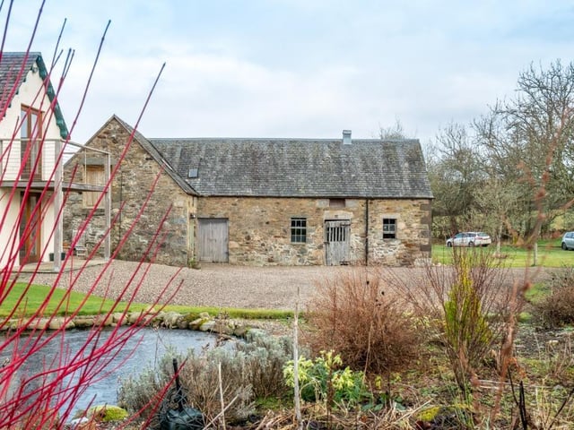 Detached steading building.