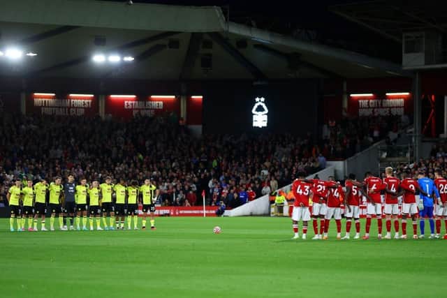 NOTTINGHAM, ENGLAND - SEPTEMBER 18: Players, fans and officials hold a minutes silence in memory of the victims of the earthquakes in Morocco and Libya prior to the Premier League match between Nottingham Forest and Burnley FC at City Ground on September 18, 2023 in Nottingham, England. (Photo by Marc Atkins/Getty Images)
