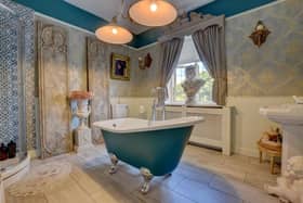 A free-standing bath in the second double bedroom