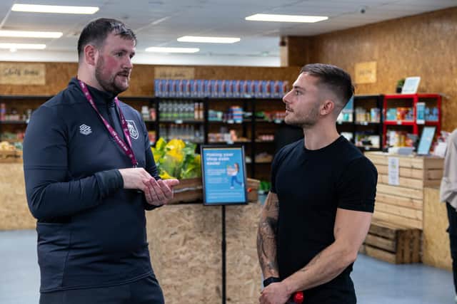Max McCann chats with Burnley Fc in the Community Foodbank manager Nathan Norris. Photo: Kelvin Lister-Stuttard