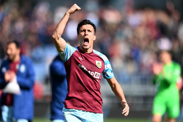 BURNLEY, ENGLAND - APRIL 24: Jack Cork of Burnley celebrates after their sides victory during the Premier League match between Burnley and Wolverhampton Wanderers at Turf Moor on April 24, 2022 in Burnley, England. (Photo by Gareth Copley/Getty Images)