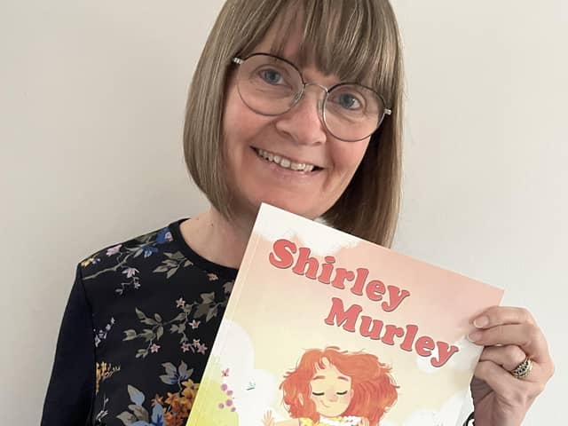 Su Murley with her new book