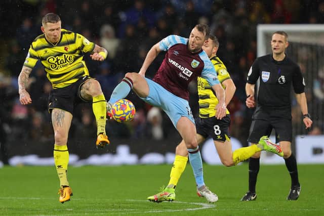 BURNLEY, ENGLAND - FEBRUARY 05: Dale Stephens of Burnley battles for possession with Juraj Kucka of Watford FC during the Premier League match between Burnley and Watford at Turf Moor on February 05, 2022 in Burnley, England. (Photo by James Gill/Getty Images)