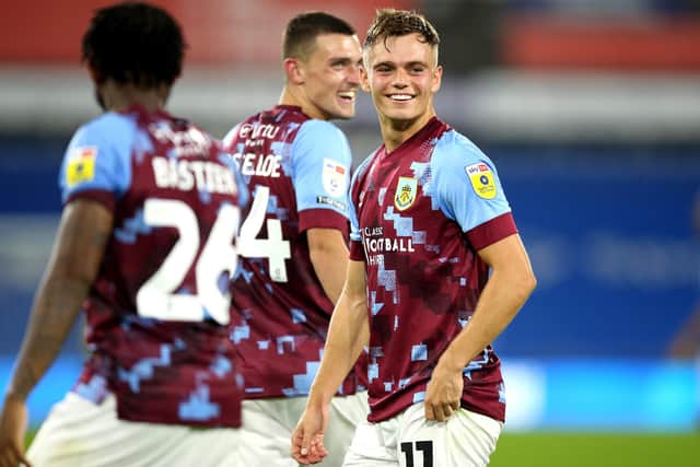 Burnley's Scott Twine (right) and team-mates celebrate victory after the final whistle during the Sky Bet Championship match at the John Smith's Stadium, Huddersfield. Picture date: Friday July 29, 2022.
