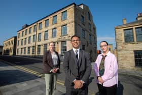 UCLan Burnley Campus strategic development lead Wendy Chester, Pro-Vice Chancellor and Provost of UCLan's Burnley campus, Professor Ebrahim Adia and UCLan Students’ Union President Zuleikha Chik outside of Sandygate Mill.