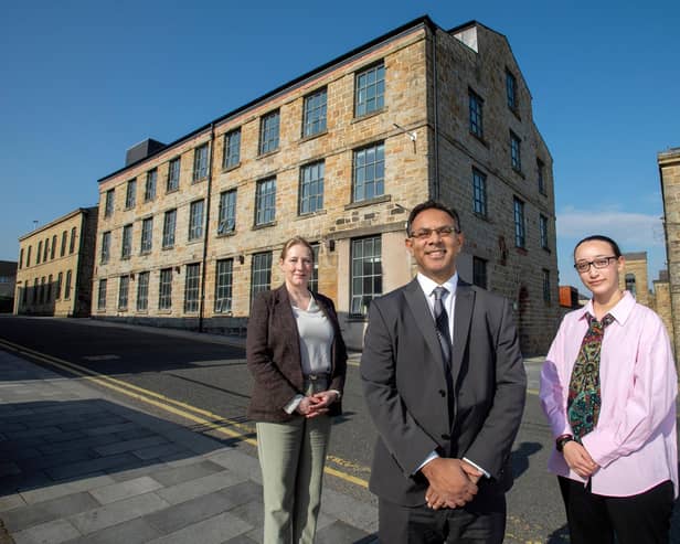 UCLan Burnley Campus strategic development lead Wendy Chester, Pro-Vice Chancellor and Provost of UCLan's Burnley campus, Professor Ebrahim Adia and UCLan Students’ Union President Zuleikha Chik outside of Sandygate Mill.
