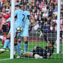 SOUTHAMPTON, ENGLAND - OCTOBER 16:  Charlie Austin of Southampton (C) scores their first goal during the Premier League match between Southampton and Burnley at St Mary's Stadium on October 16, 2016 in Southampton, England.