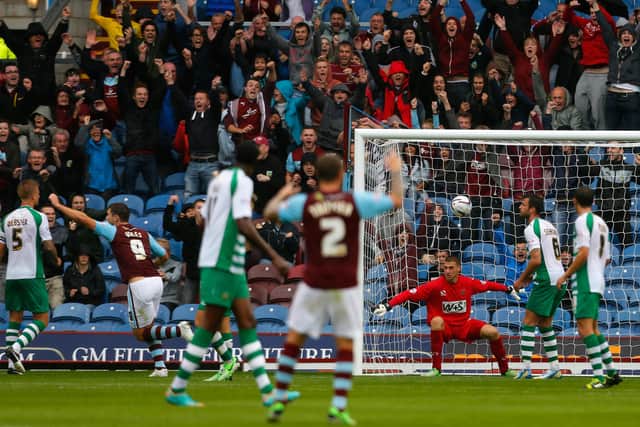 BURNLEY, ENGLAND - AUGUST 17: Sam Johnstone (3rd R) of Yeovil watches on as he fails to stop a goal by Burnley's Keith Treacy (not pictured) during the Sky Bet Championship match between Burnley and Yeovil Town at Turf Moor on August 17, 2013 in Burnley, England (Photo by Paul Thomas/Getty Images)