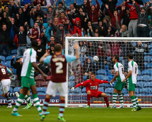 BURNLEY, ENGLAND - AUGUST 17: Sam Johnstone (3rd R) of Yeovil watches on as he fails to stop a goal by Burnley's Keith Treacy (not pictured) during the Sky Bet Championship match between Burnley and Yeovil Town at Turf Moor on August 17, 2013 in Burnley, England (Photo by Paul Thomas/Getty Images)